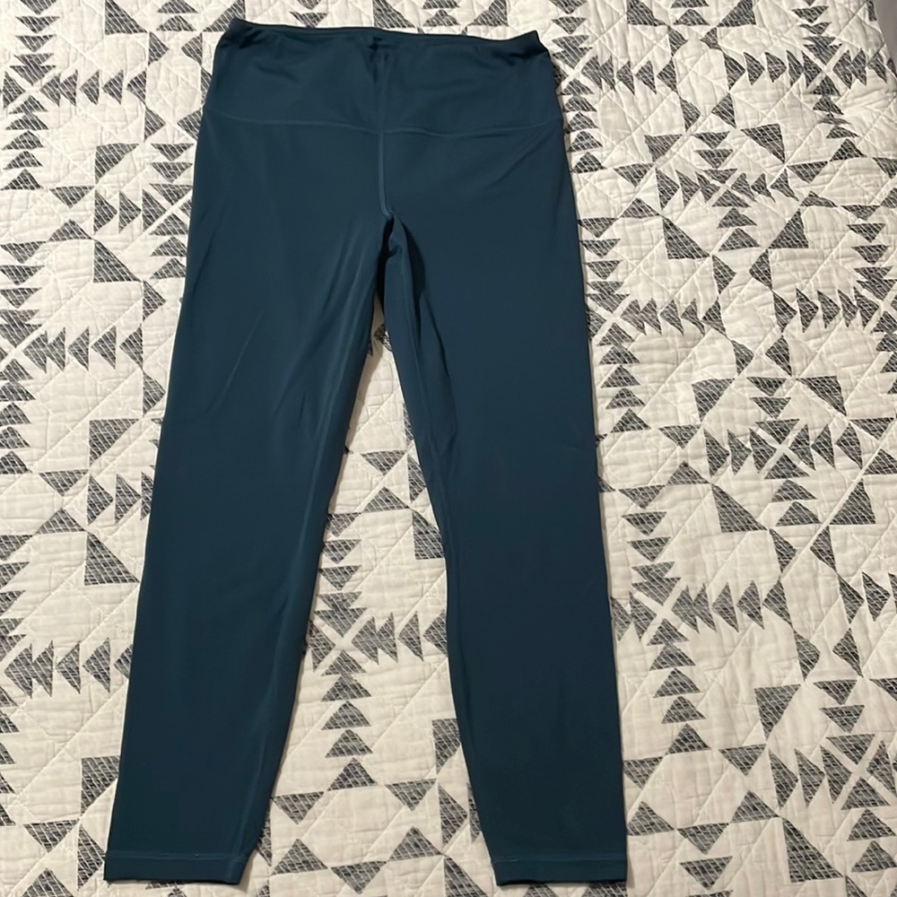 Dark teal leggings.